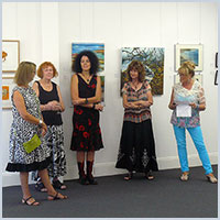 group photo of artists at opening