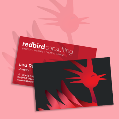 Front and back business card design featuring the Redbird emblem